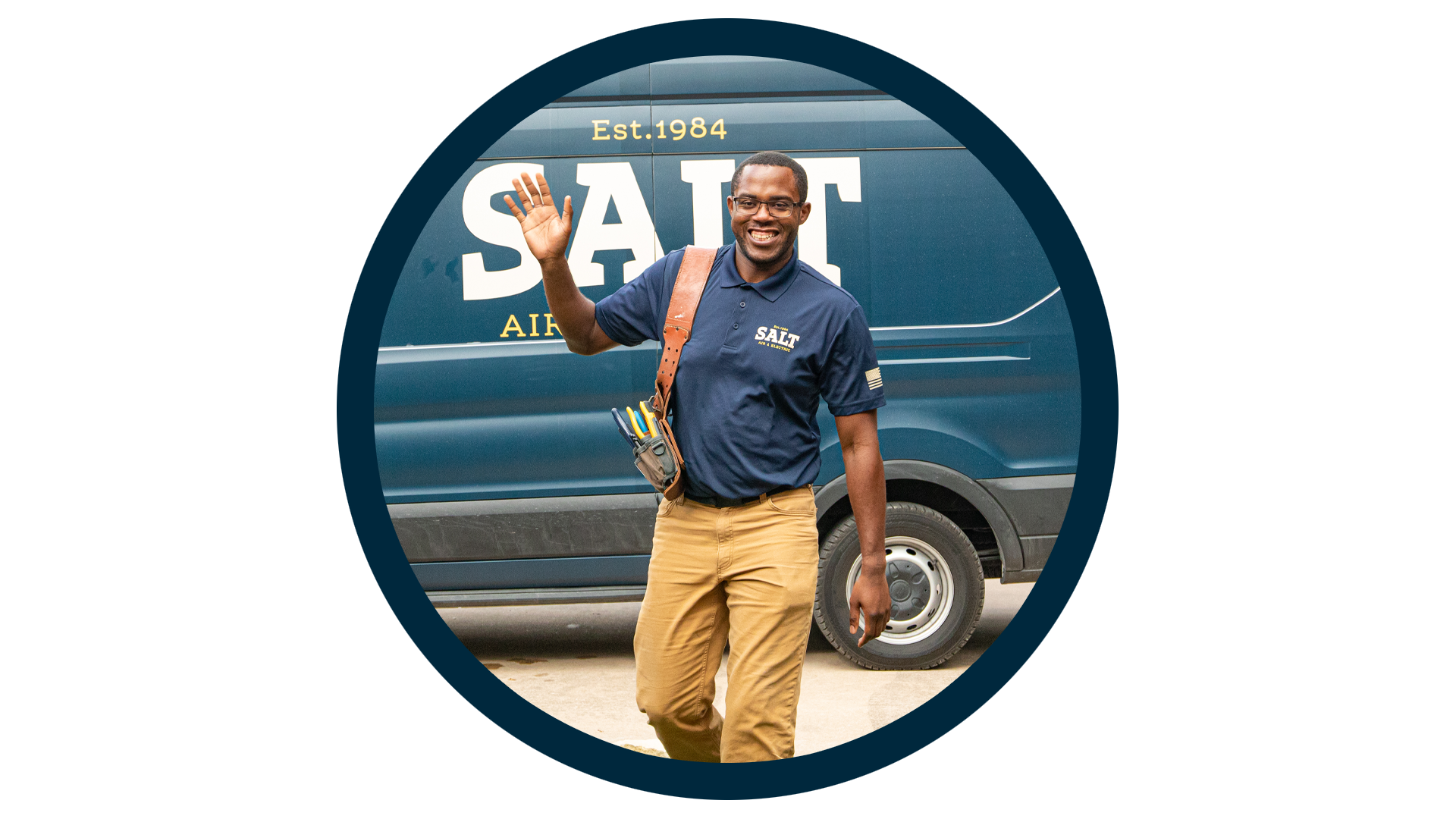 SALT technician in navy uniform carrying a tool bag, waving while walking in front of a branded company service van, framed in a circular blue outline