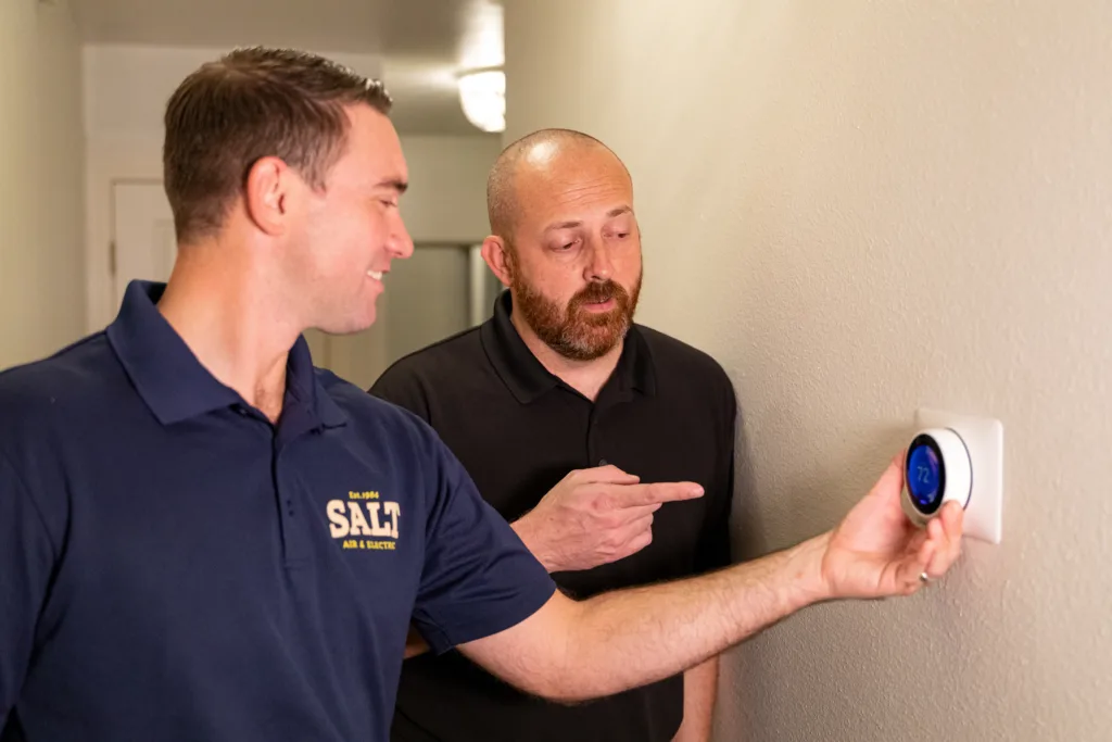 hvac technician working with customer