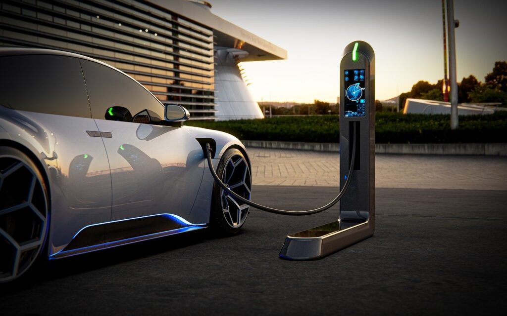 Modern electric vehicle connected to a sleek EV charging station in an urban setting