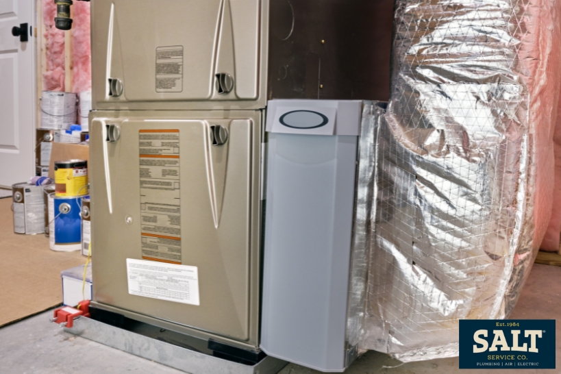 Residential gas furnace and ductwork in a Texas home for a guide on furnace repair or replacement.