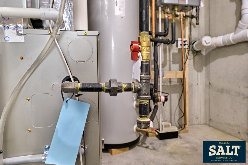 Residential furnace and gas line setup for a Texas guide on repairing or replacing a furnace.